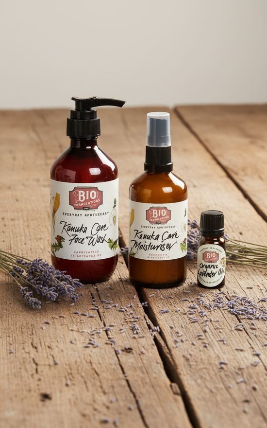 Set of skincare products including a face wash, moisturizer, and oil on a white background.